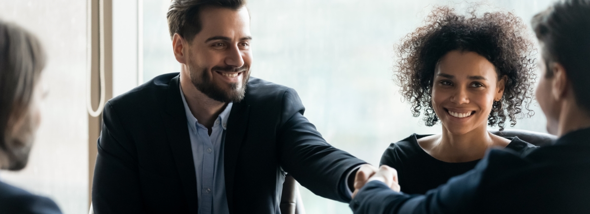 Image of business people shaking hands after becoming partners